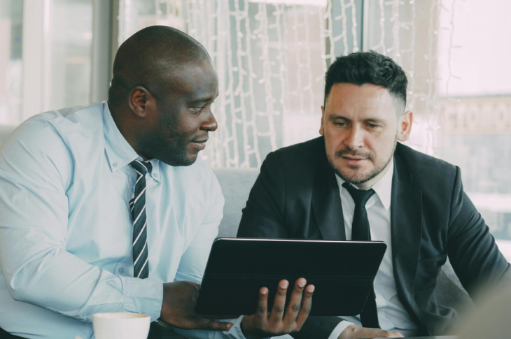 two business men talking