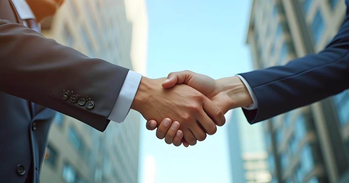 The staged sale two business men shaking hands
